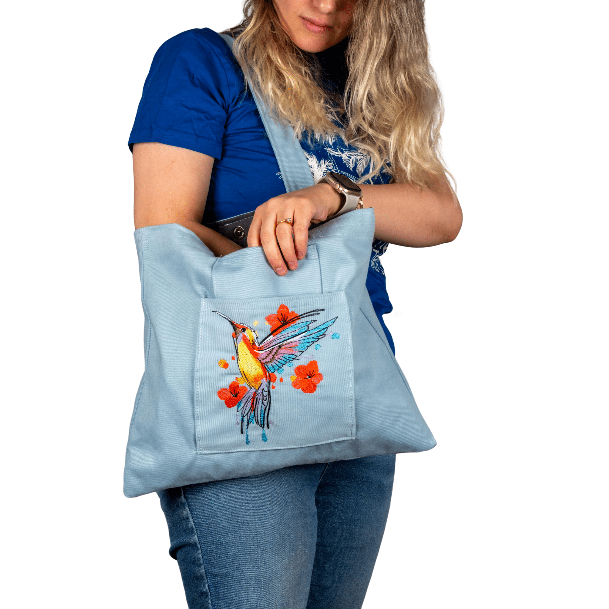 Handmade canvas bag with hummingbird embroidery, worn crossbody by model – Canvasbag