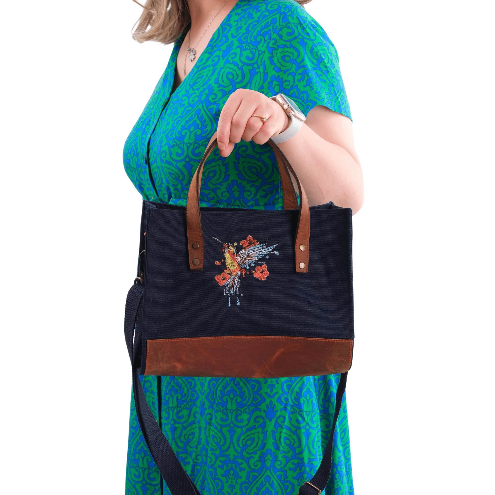 Model showing dark navy Hummingbird bag with  leather base