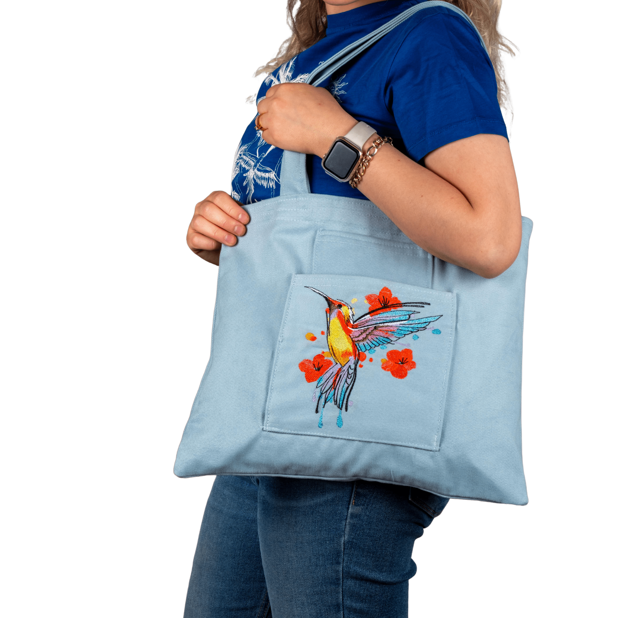 Model wearing sky blue canvas bag with hummingbird embroidery – Canvasbag