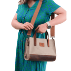 Beige canvas & leather bag worn by model – Nevas collection
