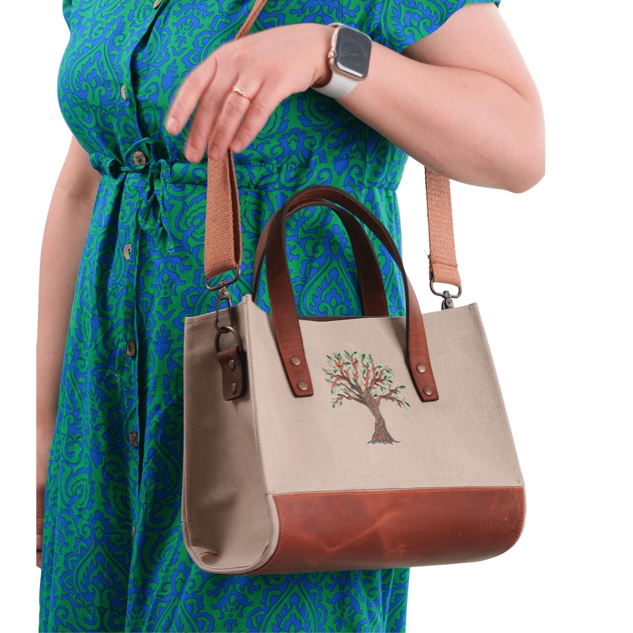 Beige canvas Olive Tree embroidered leather shoulder bag worn by model