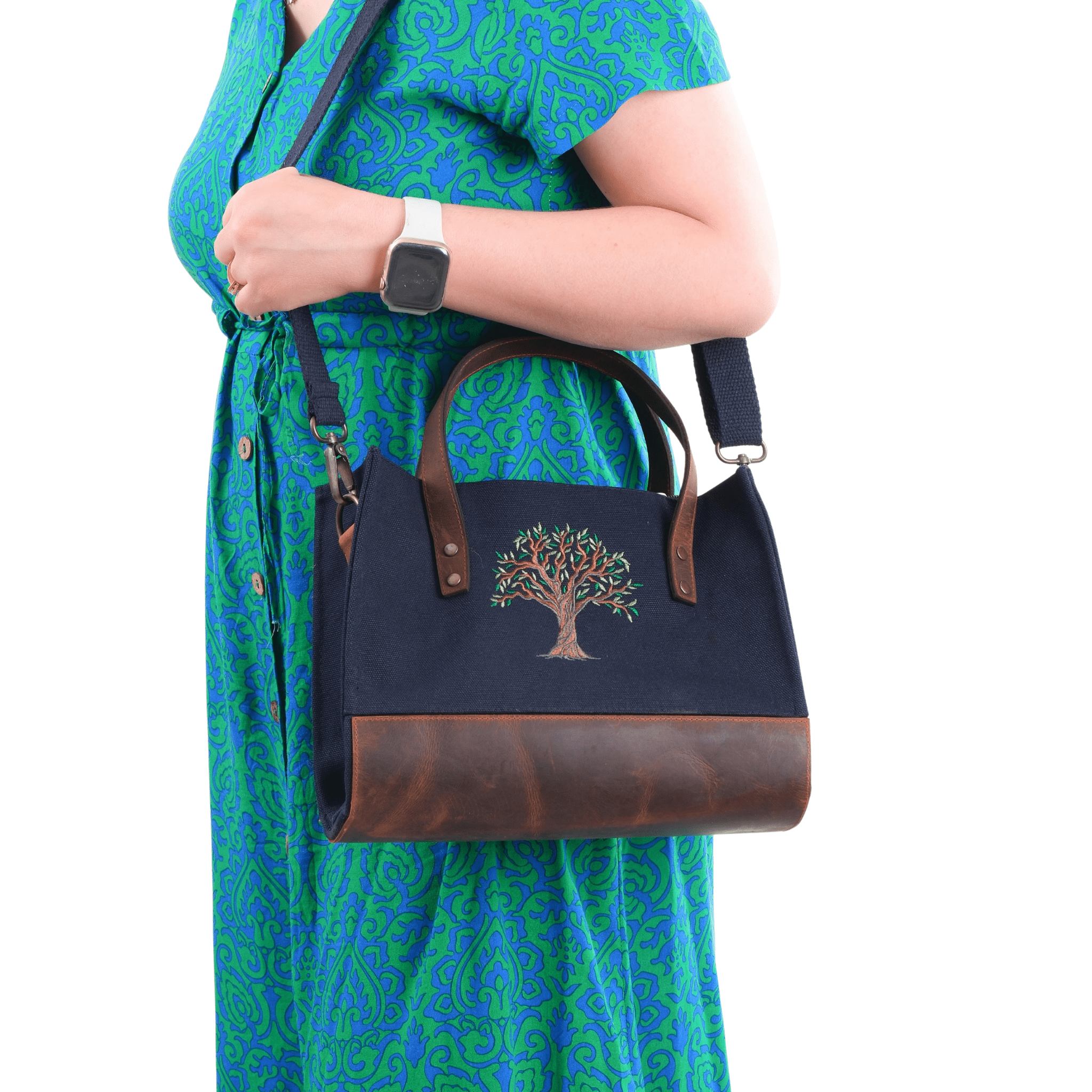 Black canvas Olive Tree embroidered leather shoulder bag worn by model