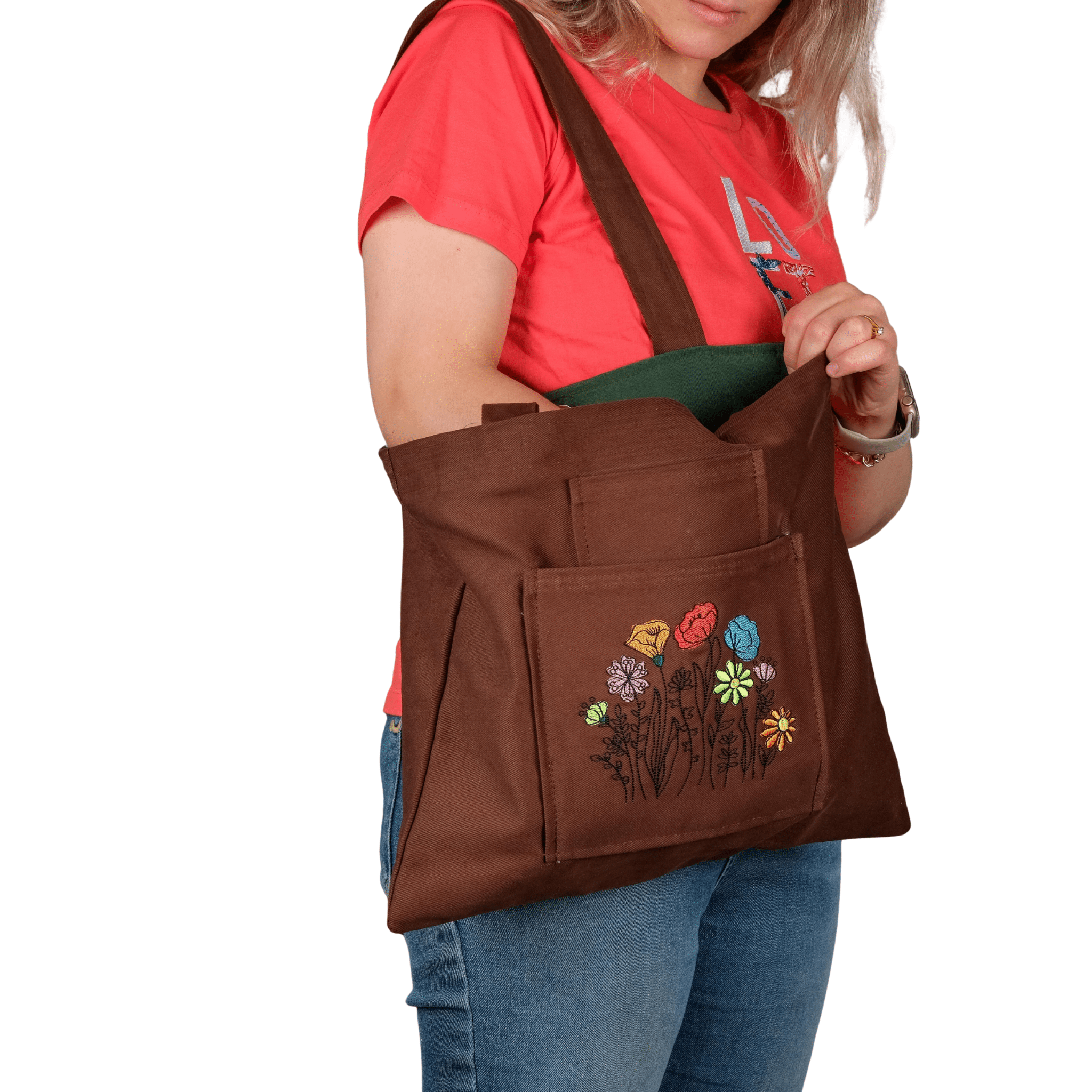 Model holding navy poppy garden embroidered canvas bag – adjustable strap – Canvasbag