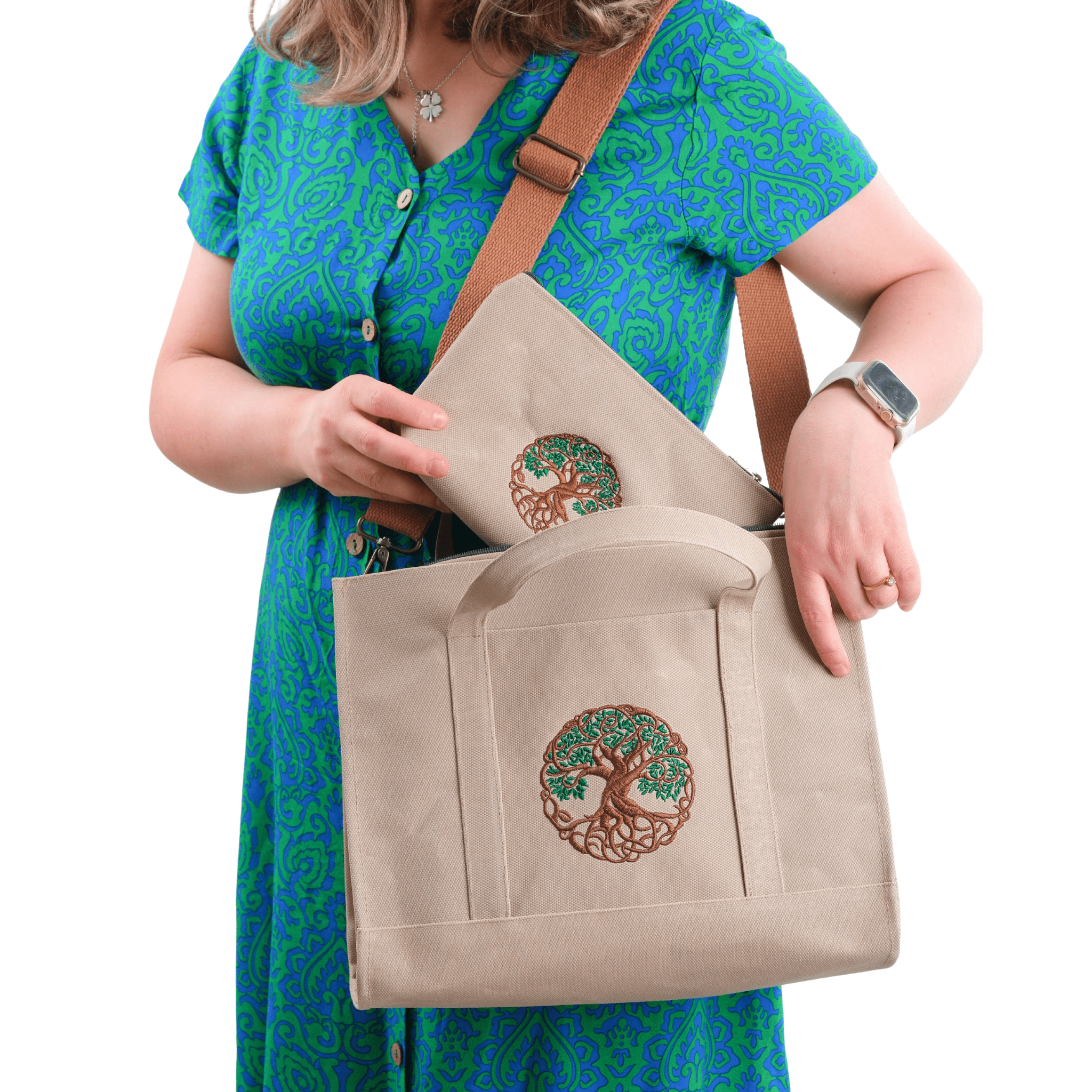 Khaki canvas Tree of Life embroidered shoulder bag held by model