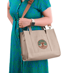 Beige canvas Tree of Life embroidered bag worn by model